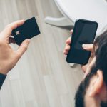 Phone payment screen representing CBDC and stablecoin comparison