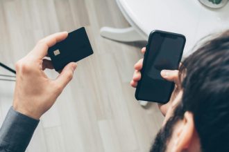 Phone payment screen representing CBDC and stablecoin comparison